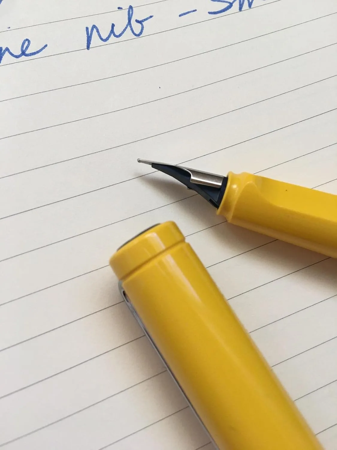 Customer photo of fountain pen writing on white paper showing ink flow and line quality